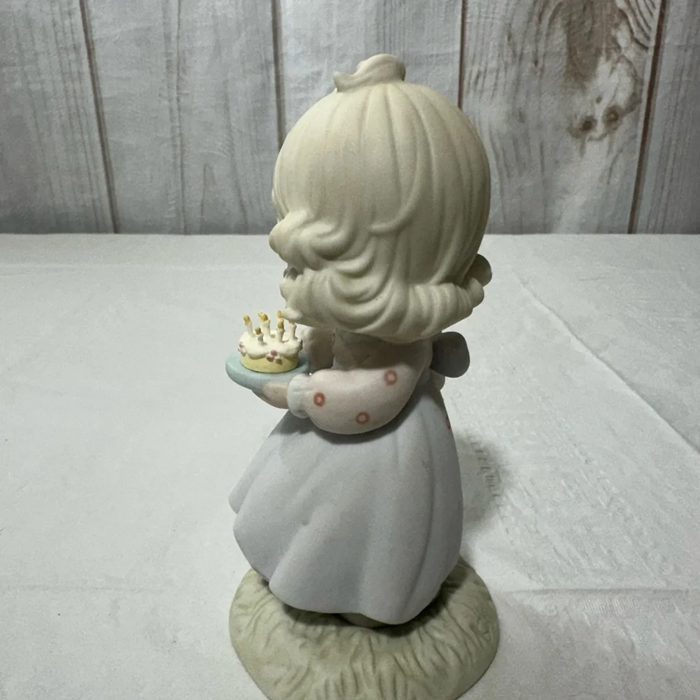 Precious Moment’s figurine titled “May Your Birthday Be A Blessing” from 1990